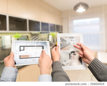 Designers discuss the sketches inside the house. Designers discuss the sketches inside the house. 39800004