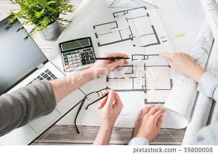 Designers discuss the sketches inside the house. Designers discuss the sketches inside the house. 39800008