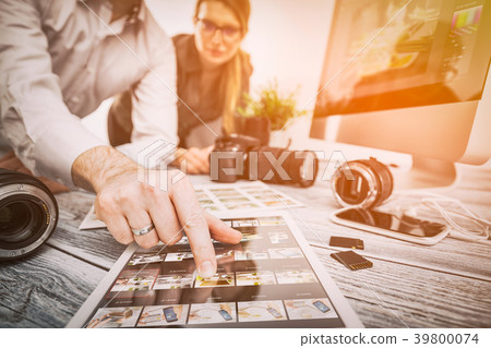 Photographers computer with photo edit programs. 39800074