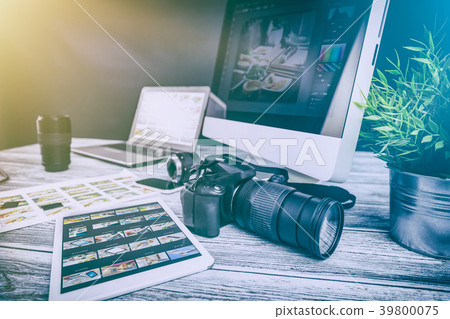 Photographers computer with photo edit programs. 39800075