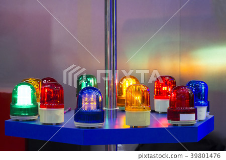 Siren lights and many colors put on a blue table. 39801476