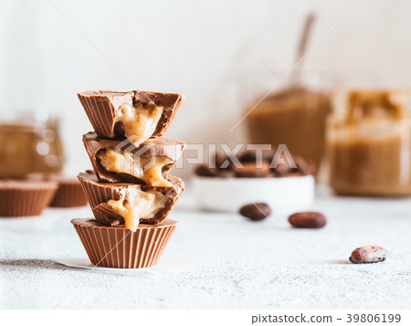 Stack of vegan chocolate cups with caramel on Stack of vegan chocolate cups with caramel on 39806199