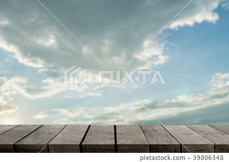 Gray wooden display shelf with sunset sky Gray wooden display shelf with sunset sky 39806348