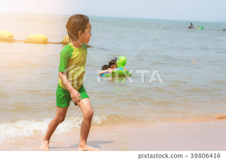 Girl is walking on beach. 39806416