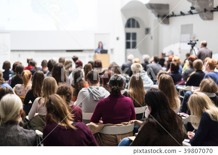 Woman giving presentation in lecture hall at Woman giving presentation in lecture hall at 39807070