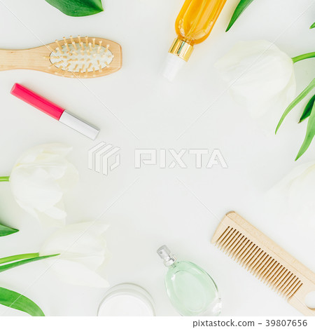 Frame with cosmetics, perfume, combs and tulips Frame with cosmetics, perfume, combs and tulips 39807656