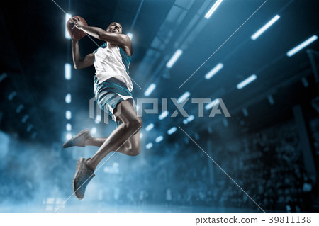 Basketball player on big professional arena during 39811138