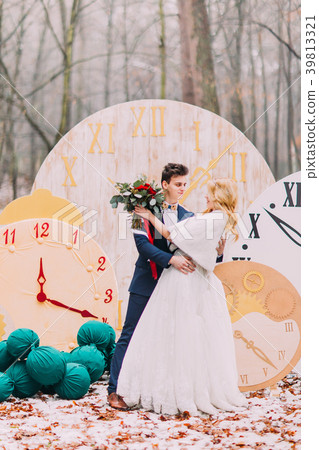 Happy wedding couple softly hugs at the big 39813321