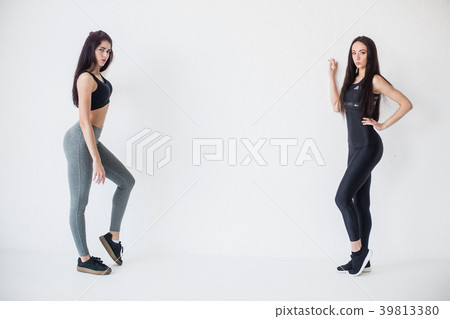 Full-length horizontal shot of two attractive Full-length horizontal shot of two attractive 39813380