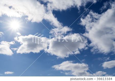 bright summer sun against a blue sky with clouds bright summer sun against a blue sky with clouds 39813384