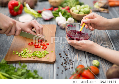 Slicing, chopping and peeling the vegetables cook. Slicing, chopping and peeling the vegetables cook. 39814414