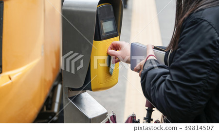 Passengers validating tickets, rush to the train,  39814507