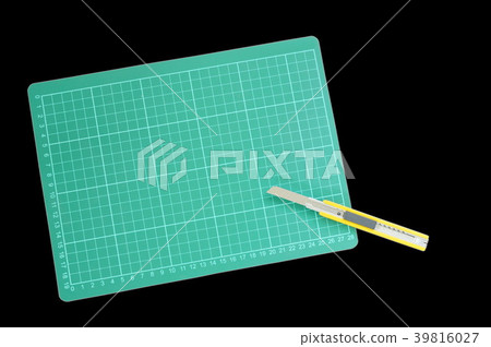 cutter opened blade and green cutting board  39816027