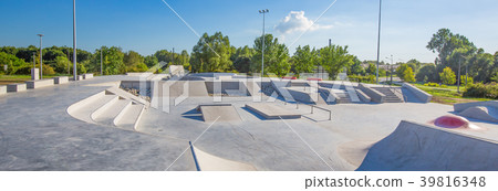 Skate Park in daytime. Urban concrete skatepark. Skate Park in daytime. Urban concrete skatepark. 39816348