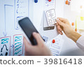 Designer drawing website ux app development. 39816418