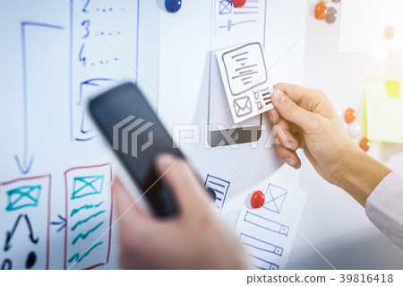 Designer drawing website ux app development. Designer drawing website ux app development. 39816418