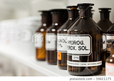 Close-up of the labeled glass container of a 39821175