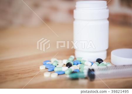 Medicine supplement and drug on wooden background, Close up of c Medicine supplement and drug on wooden background, Close up of c 39821495