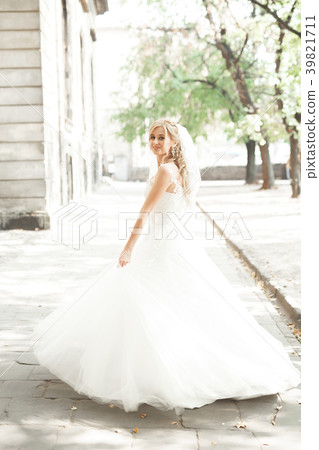 Beautiful bride spinning with perfect dress in the Beautiful bride spinning with perfect dress in the 39821711