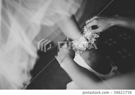 Luxury bride in white dress posing while preparing Luxury bride in white dress posing while preparing 39821756