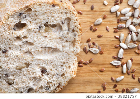 Loaves of gray bread with seeds, in a paper bag Loaves of gray bread with seeds, in a paper bag 39821757