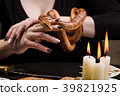 A woman will hold her hand to a snake 39821925