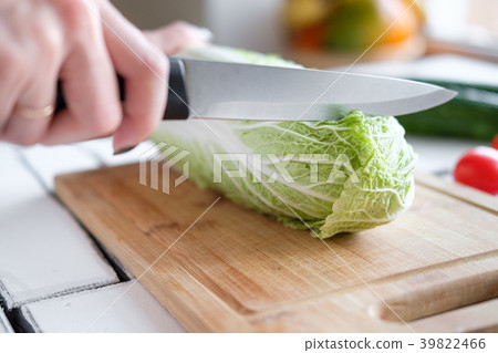 Vegetables lie on a table on a chopping board 39822466