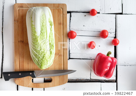 Vegetables lie on a table on a chopping board 39822467