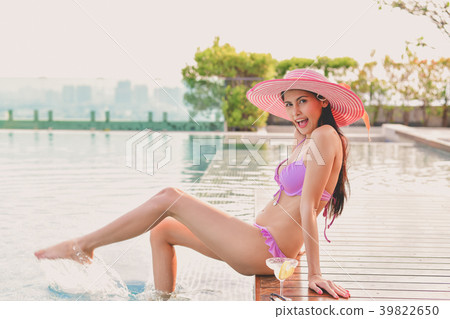 Swimsuit Concept. Beautiful girl wearing pink swimsuit. Beautifu Swimsuit Concept. Beautiful girl wearing pink swimsuit. Beautifu 39822650