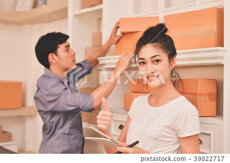 Sme business concept. Young Asian people are packing their packa 39822717