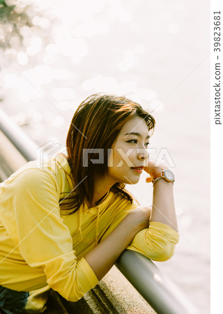 Lifestyle series: Young Asian woman in summer park Lifestyle series: Young Asian woman in summer park 39823681