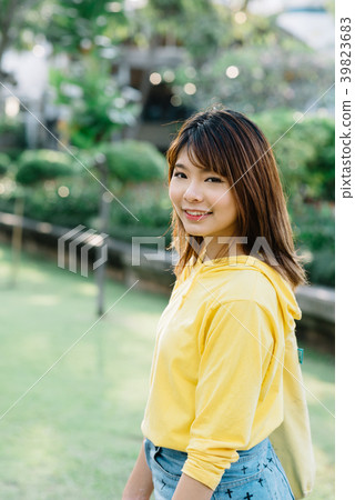 Lifestyle series: Young Asian woman in summer park Lifestyle series: Young Asian woman in summer park 39823683