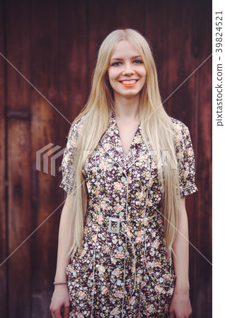 Beautiful young woman in doted summer dress  39824521