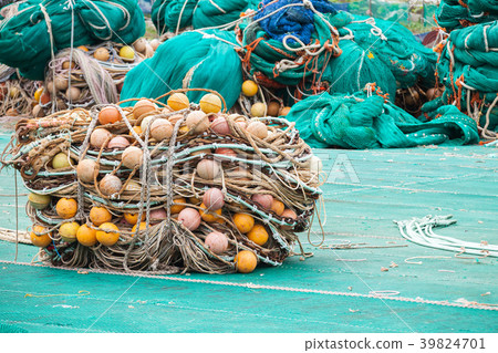 Drying fishing nets with orange floats Drying fishing nets with orange floats 39824701