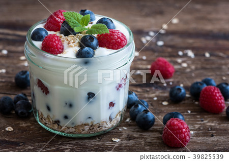 Yogurt with Fresh Berries on Woden Table Yogurt with Fresh Berries on Woden Table 39825539