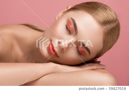 Nude woman relaxing after massage Nude woman relaxing after massage 39827019