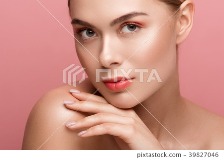 Serene female expression with light makeup Serene female expression with light makeup 39827046