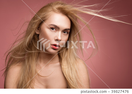 Well cared woman with flattering locks Well cared woman with flattering locks 39827476