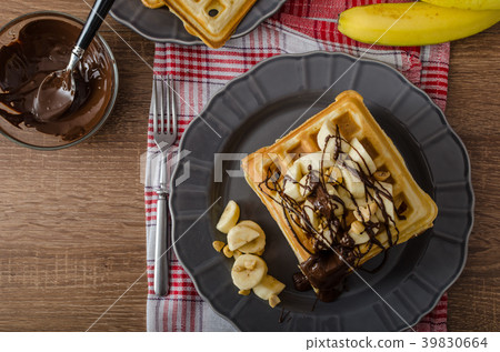 Waffles with bananas, nuts and chocolate 39830664