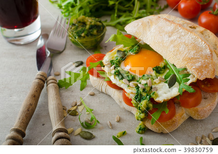 Ciabatta with fried egg, tomatoes and pesto Ciabatta with fried egg, tomatoes and pesto 39830759