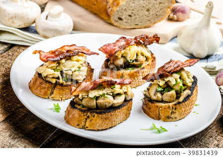 Rustic breakfast - bread toast, mushrooms, eggs Rustic breakfast - bread toast, mushrooms, eggs 39831439