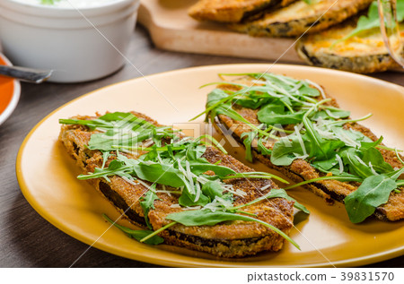 Breaded eggplant parmesan and arugula Breaded eggplant parmesan and arugula 39831570