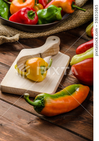 Slicing peppers with wood knife Slicing peppers with wood knife 39831665