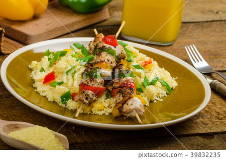 Couscous with vegetables and chicken skewer 39832235
