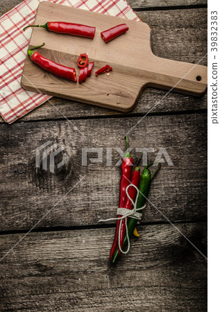 Chilli peppers, wood table, background Chilli peppers, wood table, background 39832383