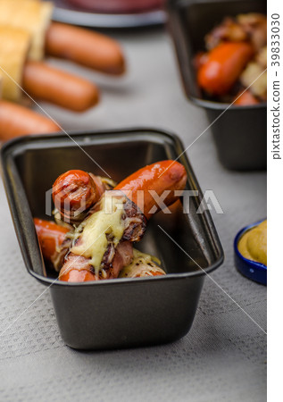 Fried sausage in a robe of bacon and cheese Fried sausage in a robe of bacon and cheese 39833030