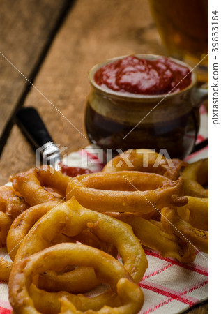 Onion rings, hot dip, french fries and Czech beer 39833184