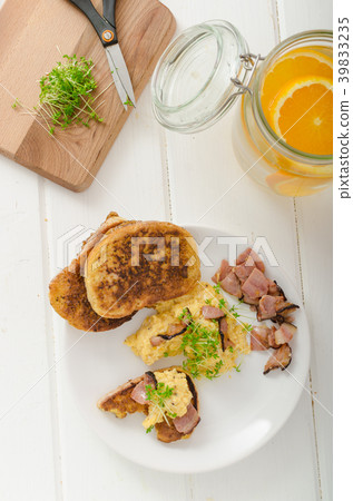 Scrambled eggs with French toast topped with watercress Scrambled eggs with watercress, french toast Scrambled eggs with French toast topped with watercress Scrambled eggs with watercress, french toast 39833235
