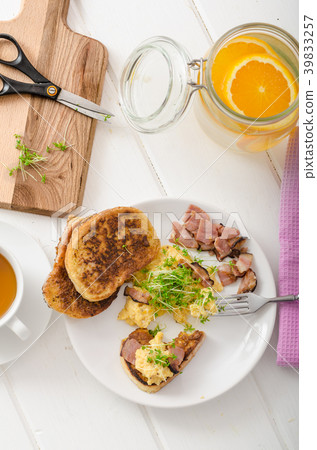 Scrambled eggs with French toast topped with watercress Scrambled eggs with watercress, french toast Scrambled eggs with French toast topped with watercress Scrambled eggs with watercress, french toast 39833257