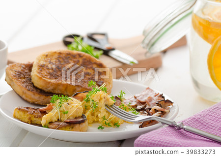 Scrambled eggs with French toast topped with watercress Scrambled eggs with watercress, french toast Scrambled eggs with French toast topped with watercress Scrambled eggs with watercress, french toast 39833273